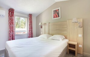 Drift to sleep in a comfortable bed after a wonderful day outside. Bedding configurations vary.