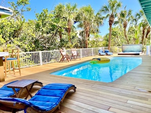 25' x 11' heated pool and hot tub surrounded by lush landscaping. 
