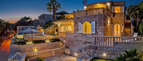Night picture of the property of family luxury villa Stone Castle in Selca with private heated pool for vacation and rent