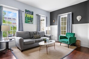 A modern lounge with a sofa and designer touches.