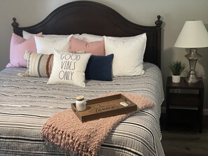 Cozy master bedroom with luxerous sheets and matress.