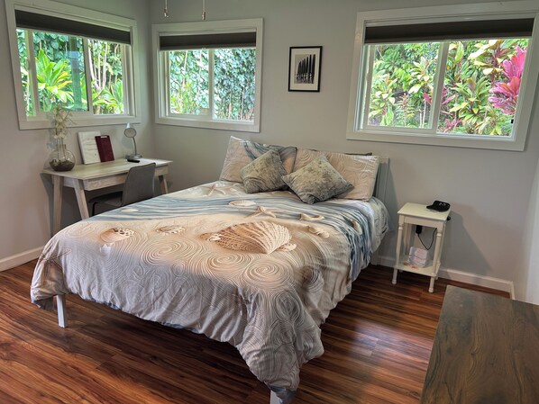 Queen bed and desk area