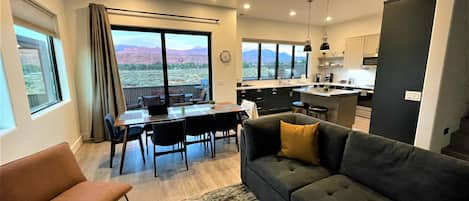 Image of living/dining room with sliding door to patio. Beautiful views.