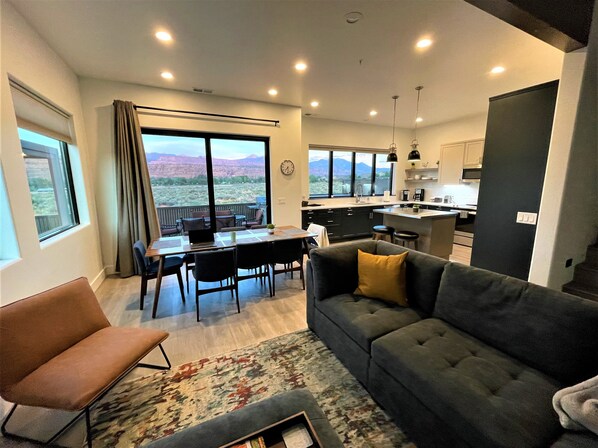 Image of living/dining room with sliding door to patio. Beautiful views.