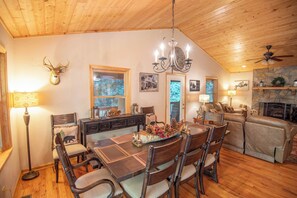 Family style dining room with vaulted ceilings...