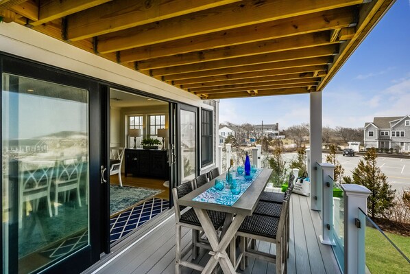 Dining as the sea roars in the background - 74 E Bay View Road Dennis Cape Cod - New England Vacation Rentals