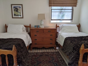 One of two nearly identical twin bed rooms downstairs