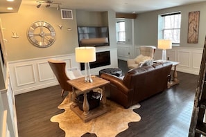 Living Room with Dish TV and Electric Fireplace
