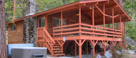 Front of home with hot tub to the left of stairs up to front door!