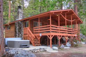 Front of home with hot tub to the left of stairs up to front door!