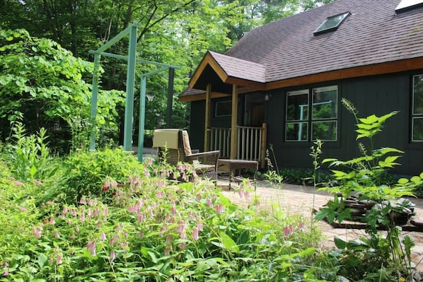 Entrance to chalet in summer - surround by nature.