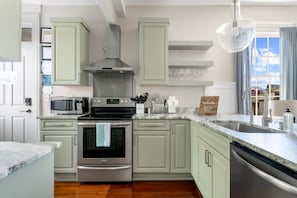 Modern kitchen with stainless steel appliances for all your cooking needs.