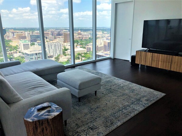 Living Area with large sectional, 75" TV, Sonos surround sound