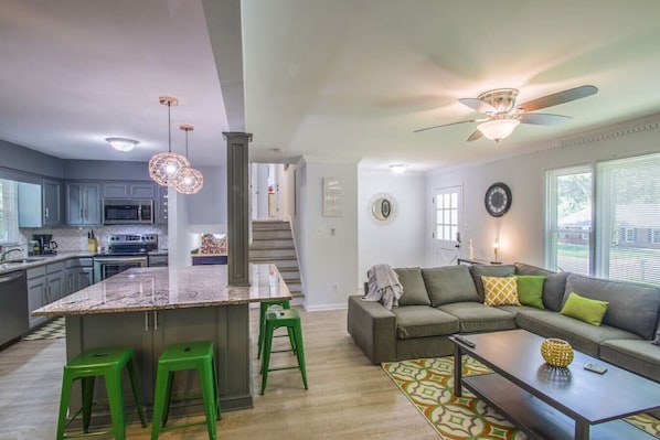 Open space living room and kitchen with large island for gathering