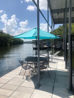 Long dock with 2 lounge chairs and table w/4 chairs and umbrella