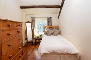 This second bedroom can either be used as a single or twin bedroom.  There is a built in wardrobe and chest of drawers.