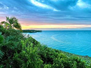 Enjoy the views from a cliff overlooking the Caribbean, with 50-mile ocean and sunset views!
