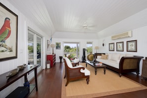 Large and elegantly furnished living room with ocean views