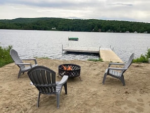 Enjoy the sandy beach, campfire and adirondack chairs
