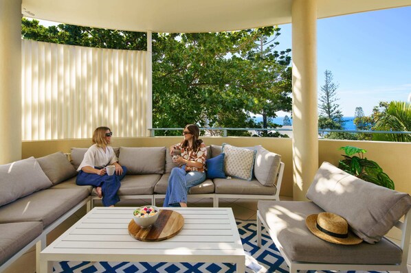 Relax in the outdoor area & soak up the sea views.