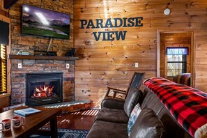 Super cozy living room with a gas fireplace and smart tv.