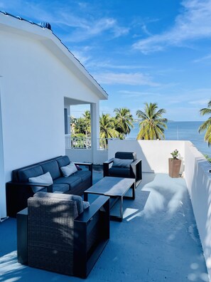 Large private penthouse terrace with ocean and tropical views. 