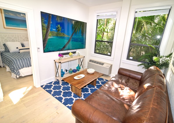Living Room with Bedroom in Background
