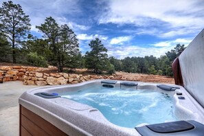 Private hot tub with view of back yard. 