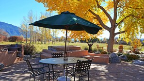 Favorite gathering spot expanded to show jumbo hot tub (center with lid down) and gas grill to left (outdoor fireplace not shown)