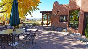 Patio table looking toward “portal with hanging sky chairs” and further west for amazing sunsets