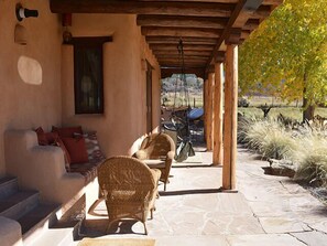 Close up of “Portal” (Spanish for covered walkway or patio) offers serene getaway with 180 degree views and a couple of Sky Chairs for the young at heart