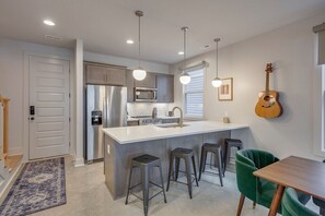 Additional bar seating off the dining room gives all your guests a place to dine together.