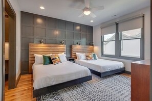 Wake up to natural light in our 2-queen bedroom, or keep the blinds completely closed for a restful sleep-in—your choice.