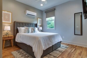 A queen-sized bed awaits to offer you restful slumber and ample room to unwind in this  expansive primary suite.