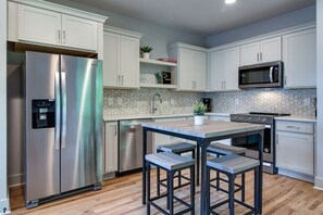 Modern appliances add a beautiful and efficient touch to our open plan kitchen.
