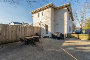 A large fully fenced back patio, excellent for pups to run around.