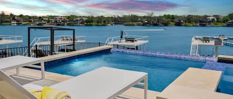 Lounge by the infinity pool and take in the beautiful views of Lake LBJ