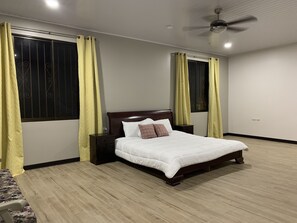 Master bedroom with master bathroom and walk-in closet
