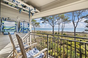 4 Beach Chairs stored in the overhead and on the balcony wall.