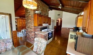 Fully equipped kitchen with dining outside over the water.