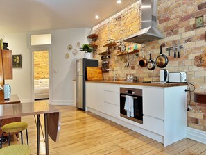 (Kitchen) with oven, full sized fridge and hob