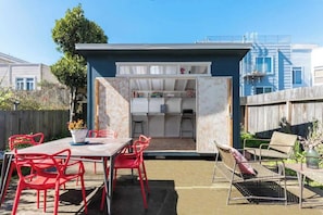 A backyard arranged for relaxation and conversation.