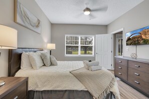 Master bedroom: Queen bed, smart TV, dresser, standing mirror, natural light!