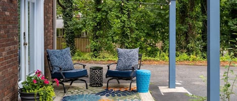 Relax on this cozy whimsical patio