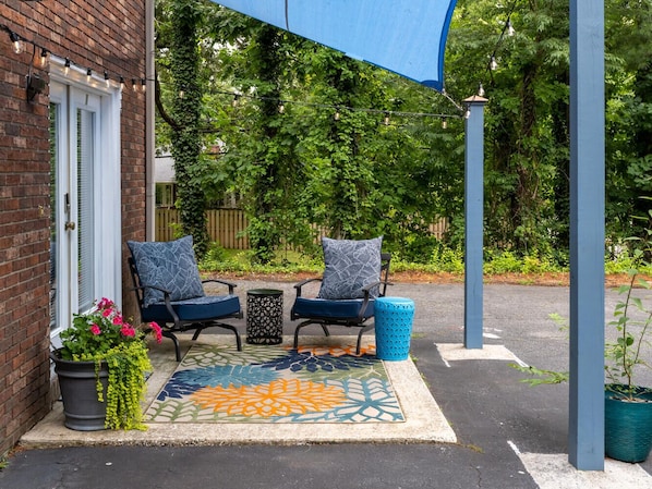 Relax on this cozy whimsical patio