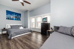 3rd floor master bedroom with ROKU TV and additional twin beds