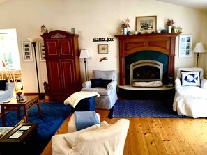 Enjoy year round comfort with a warm fire, beach views, and big TV.