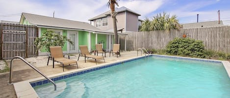 Sparkling pool with lounge chairs