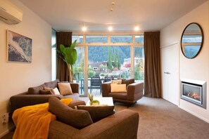 Comfortable Living Room with Fireplace and AC – Enjoy year-round comfort in this inviting living room, featuring a cozy fireplace for chilly evenings and air conditioning for warm summer days.