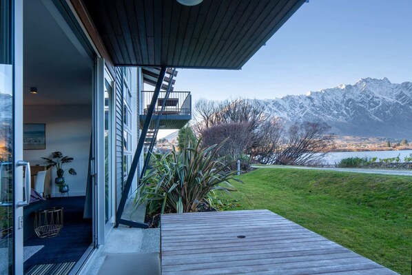 Step from your deck onto the grass and into the water - NZ luxury travel